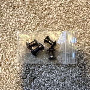 Black combat helmet bolts